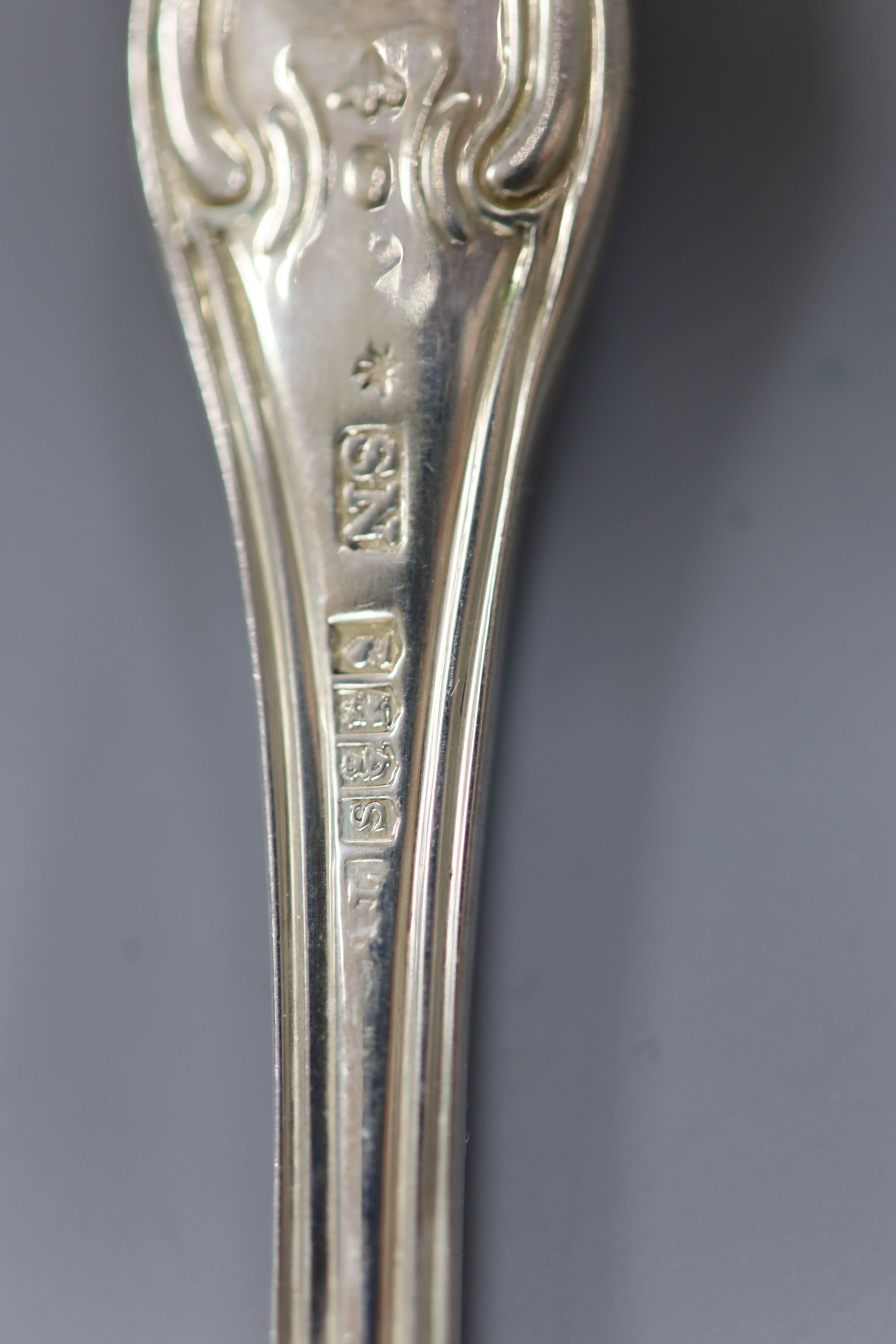 A set of six George III Irish silver hourglass pattern table spoons and four table forks, Dublin, 1813/4, Edwd. Twycross, 32oz.